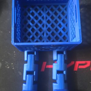 Mini Crate Flexi Buddy - 3D printed milk crate character with articulated legs, blue PLA
